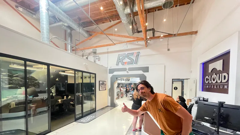 A picture of me, in the Los Angeles Office Entrance, doing a Thumbs up